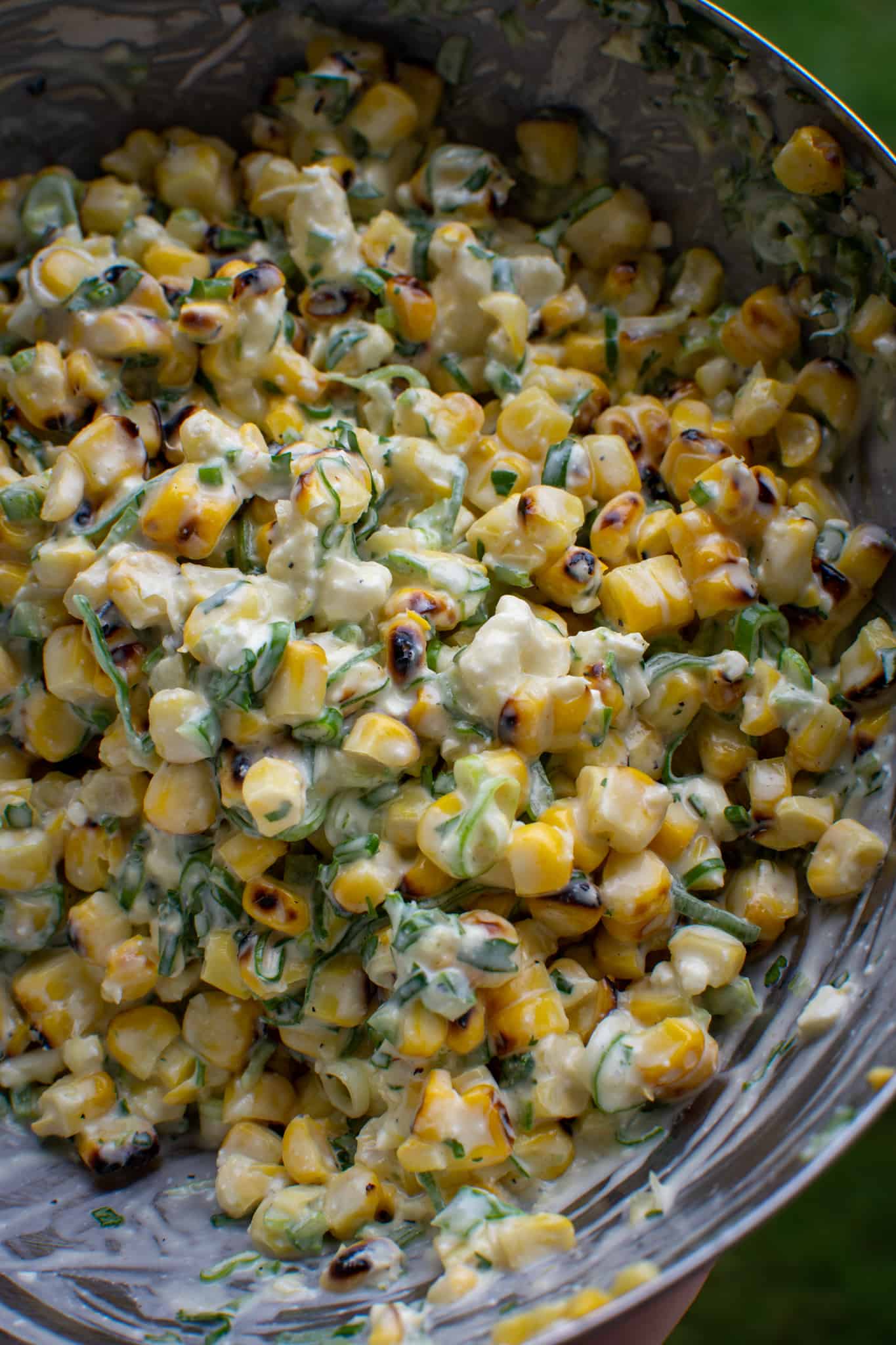 close up of corn elote in a bowl