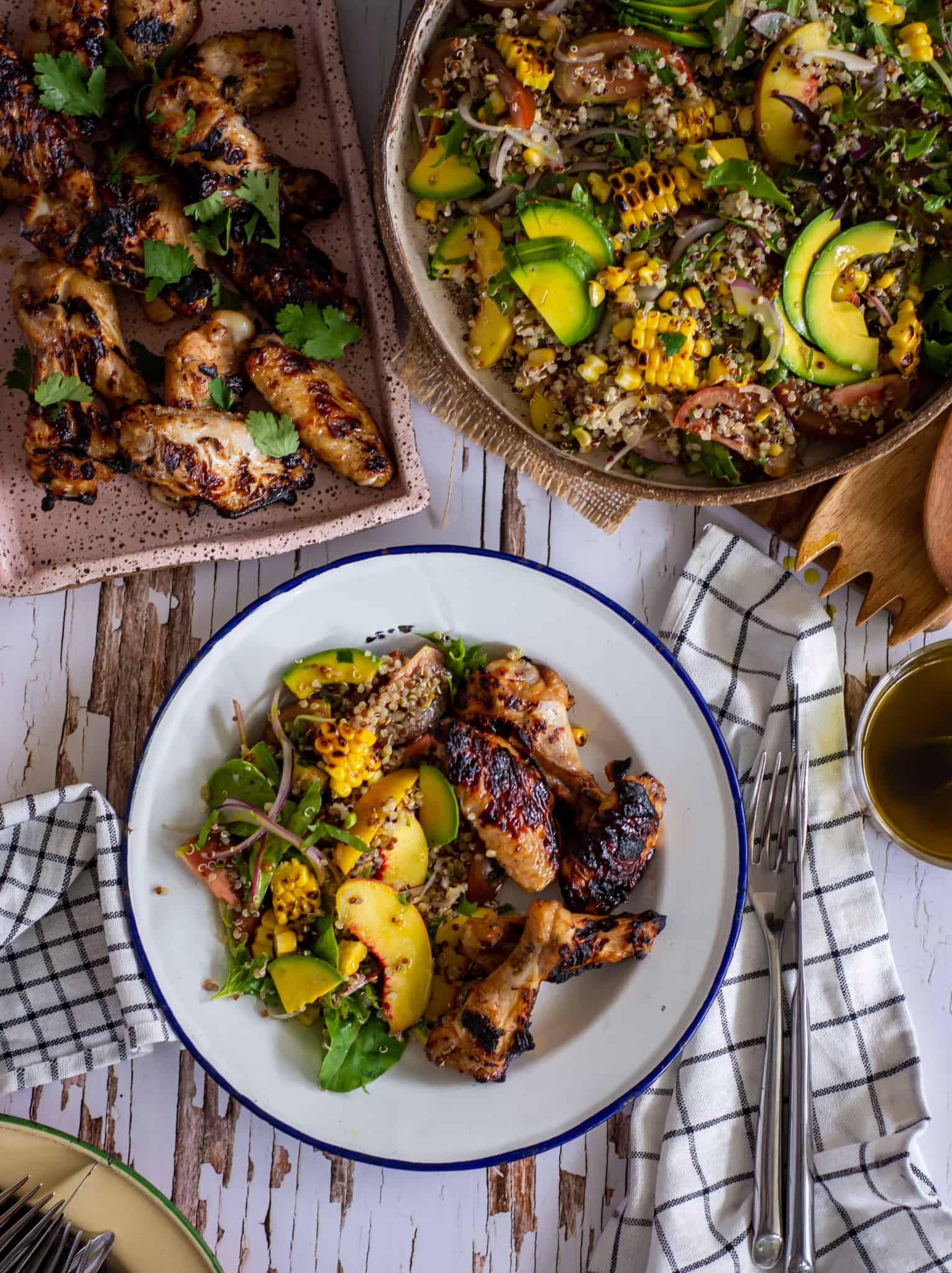 birdseye view of grain salad and grilled chicken nibbles on a plate