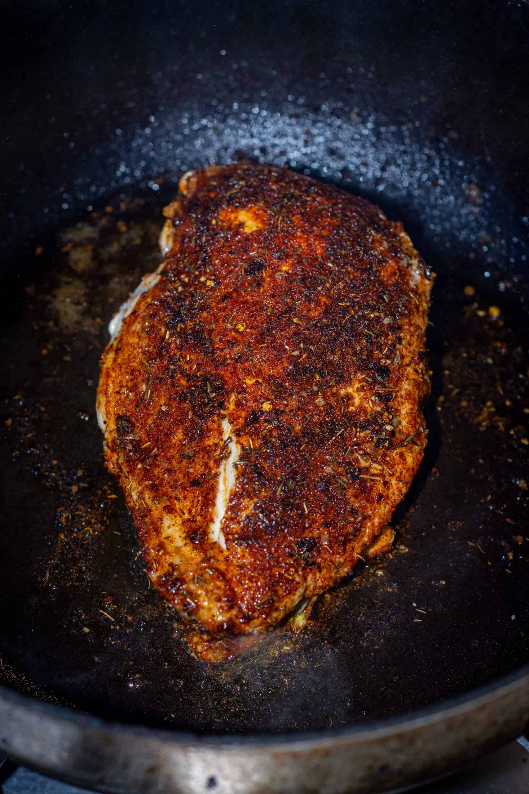 blackened chicken in a pan