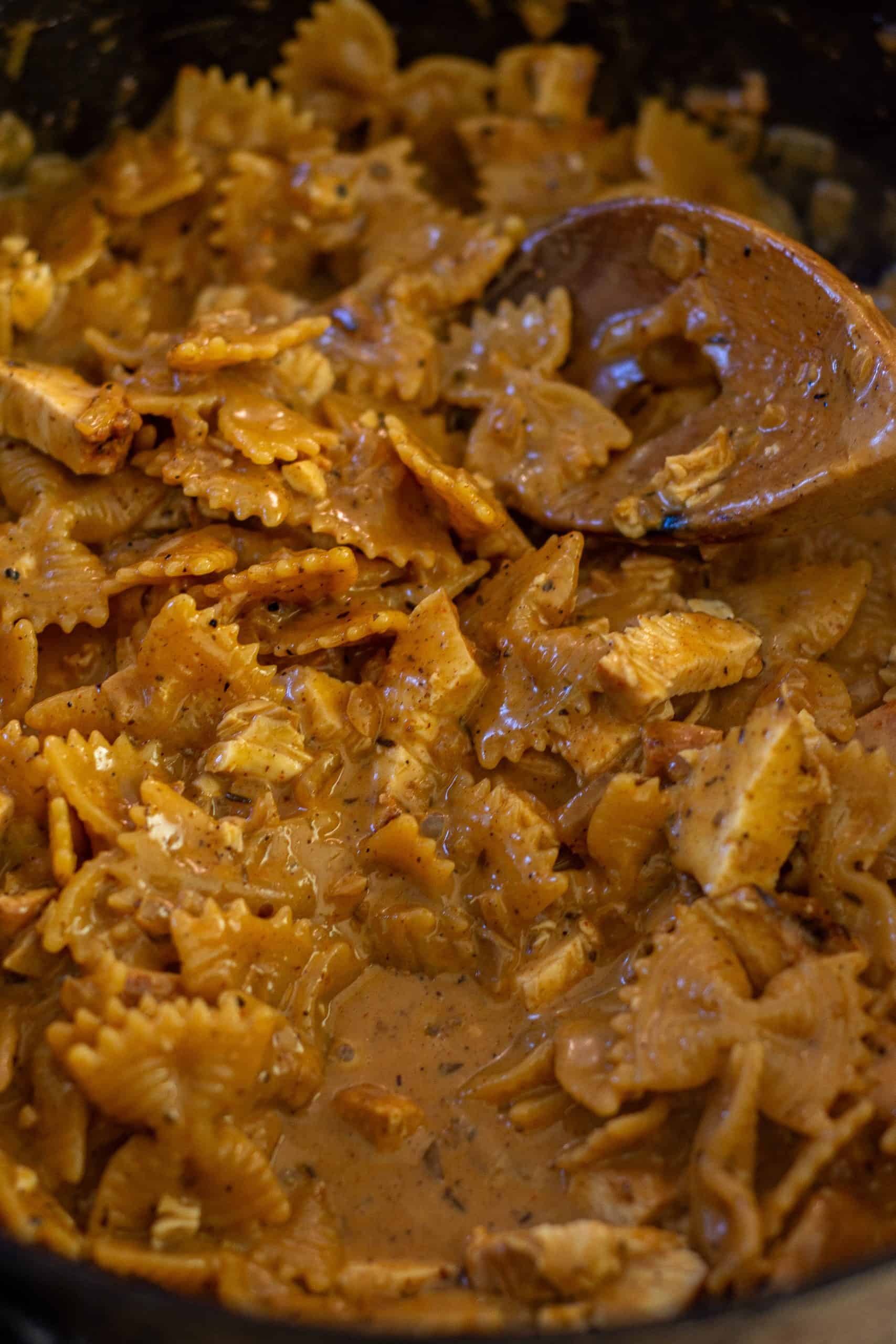 Delicious blackened chicken pasta in saucepan